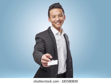 Portrait Of Young Asian Man Showing A Visit Card