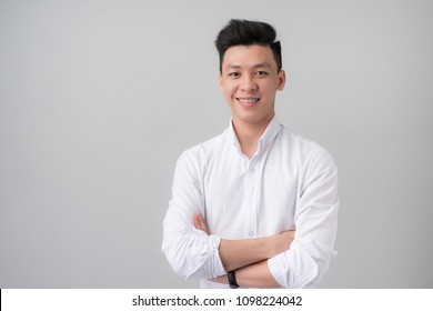 Portrait Of Young Asian Man In Studio.