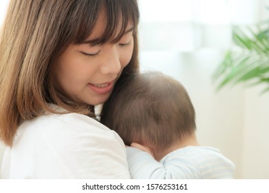 Portrait Of Young Asian Mother And Baby 