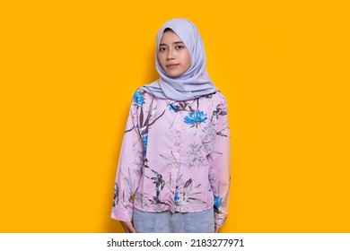 Portrait Young Asian Muslim Woman In Head Scarf Isolated On Yellow Background
