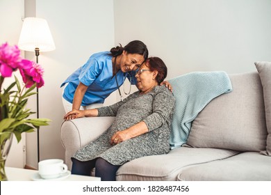 Portrait Of Young Asian Nurse With Elderly Woman. Helpful Volunteer Taking Care Of Senior Lady At Healthcare Home. Picture Of A Senior Lady With Her Friendly Caregiver.