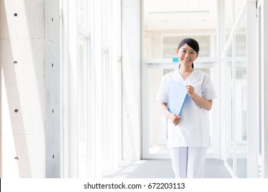 Portrait Of Young Asian Nurse In Hospital