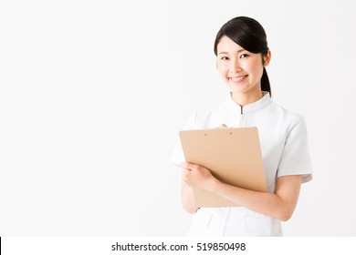 Portrait Of Young Asian Nurse Isolated On White Background