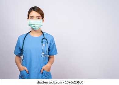 Portrait of young asian nurse wearing surgical mask - Shutterstock ID 1696620100