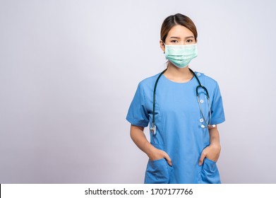 Portrait Of Young Asian Nurse Wearing Surgical Mask