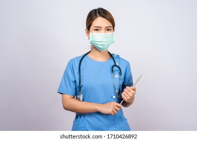 Portrait Of Young Asian Nurse Wearing Surgical Mask