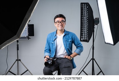 Portrait of young Asian photographer - Powered by Shutterstock