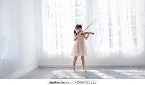 Portrait of young asian toddler little girl practice learning violin class room in white room at home or school isolated. Education, hobby leisure professional skill lifestyle concept - Powered by Shutterstock