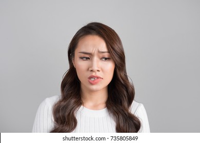 A Portrait Of Young Asian Woman With Annoyed Face