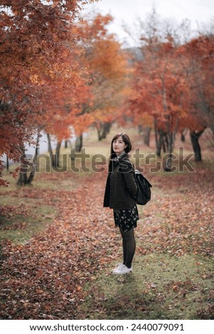 Similar – Beautiful young woman smiling and walking happy on the park outdoors