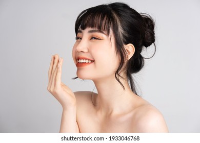 Portrait Of Young Asian Woman With Beautiful Skin And Smile