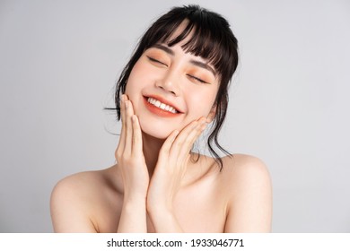 Portrait of young Asian woman with beautiful skin and smile