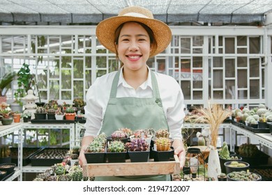 Portrait Of Young Asian Woman SME Small Business Entrepreneur As Cactus Plant Farm Owner Smile