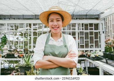 Portrait Of Young Asian Woman SME Small Business Entrepreneur As Cactus Plant Farm Owner Smile