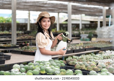Portrait Of Young Asian Woman SME Small Business Entrepreneur As Cactus Plant Farm Owner Smile