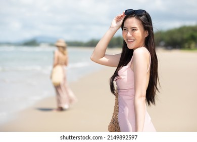 Portrait Young Asian Woman Smiling And Enjoy Travel On The Beach