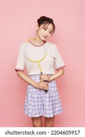 Portrait Of Young Asian Woman In Sporty Fashion On Pink Background