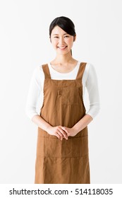 Portrait Of Young Asian Woman Wearing Apron Isolated On White Background