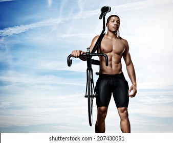 Portrait Of A Young Athlete With Bicycle