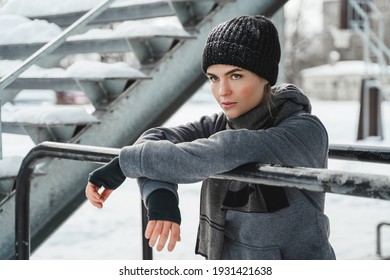 Portrait Of Young Athletic Woman During Her Winter Workout Outside