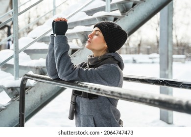 Portrait Of Young Athletic Woman During Her Winter Workout Outside