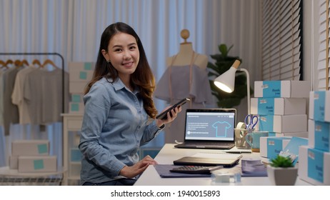 Portrait Young Attractive Asia Female Owner Startup Business Look At Camera Work Happy With Box At Home Prepare Parcel Delivery In Sme Supply Chain, Procurement, Omnichannel Commerce Online Concept.