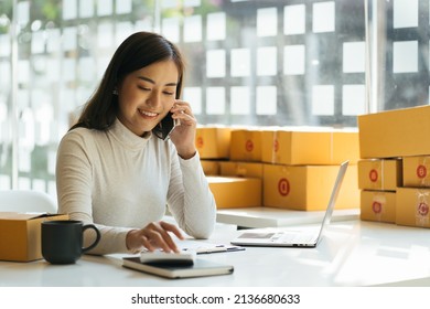 Portrait Young Attractive Asia Female Owner Startup Business Look At Camera Work Happy With Box At Home Prepare Parcel Delivery In Sme Supply Chain, Procurement, Omnichannel Commerce Online Concept.