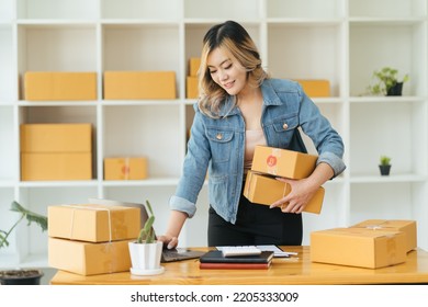 Portrait Young Attractive Asia Female Owner Startup Business Work Happy With Box At Home Prepare Parcel Delivery In Sme Supply Chain, Procurement, Omnichannel Commerce Online Concept.