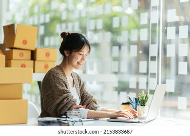 Portrait Young Attractive Asian Female Owner Startup Business Work Happy With Box At Home Prepare Parcel Delivery In Sme Supply Chain, Start Up Small Business Concept.