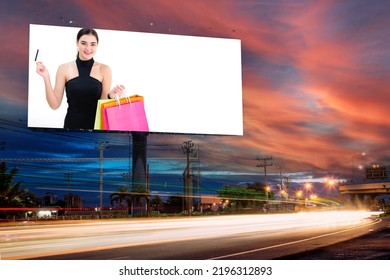 Portrait Of Young Attractive Beautiful Woman Hold The Shopping Bags Advertise On Billboard Blank For Outdoor Advertising Poster Or Blank Billboard For Advertisement