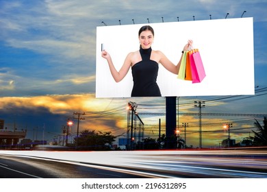 Portrait Of Young Attractive Beautiful Woman Hold The Shopping Bags Advertise On Billboard Blank For Outdoor Advertising Poster Or Blank Billboard For Advertisement