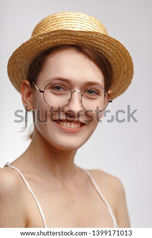 Similar – Woman, pretty, young, glasses, hat, upper body