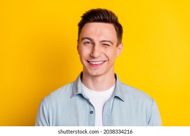 Portrait Of Young Attractive Handsome Flirty Man Wink Blink Eye Romance Expression Isolated On Yellow Color Background