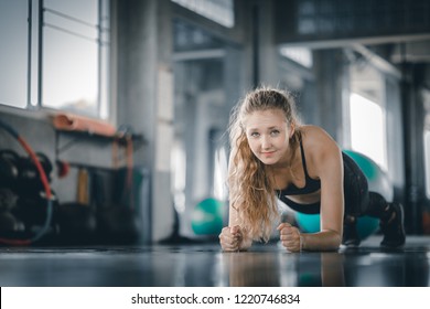 Portrait young attractive healthy woman body curve fitness doing push ups exercises workout with ball in gym. People beauty perfect body slim fitness girl. Freedom happy and relax lifestyle healthcare