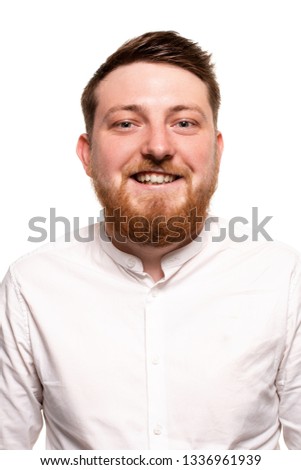 Portrait of a young attractive man in a white shirt, with beard and mustache, isolated on a white background