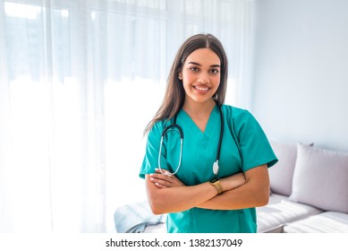 Portrait Of Young Attractive Smiling Nurse. Hoome Nurse. Caucasian Woman Working In Nursing Home. Beautiful Young Nurse Woman Wearing Uniform And Stethoscope