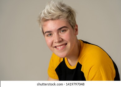 Portrait of young attractive stylish fashion teenager confident and happy with his gender identity. Trans boy posing in cool urban fashion t shirt. In Beauty, Transgender people and Equality concept.