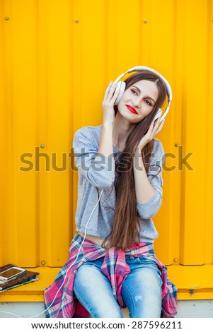 Similar – Young redhead woman listening to music