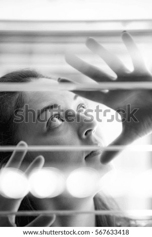 Similar – Image, Stock Photo Shadows of a blind fall on the face of a woman