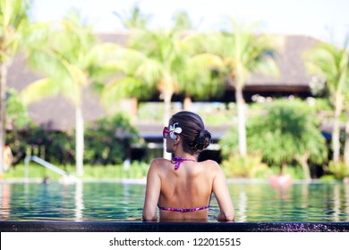 Portrait Of Young Attractive Woman In Luxury Pool