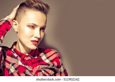 Portrait of young attractive woman with short hair. toned vintage dark image