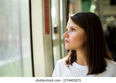 Portrait Of Young Attractive Woman Traveling In Modern Streetcar