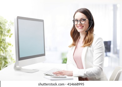 Portrait Young Bank Employee Working On Call Center While Sitting In Front Of Computer.