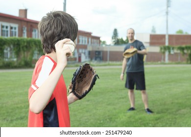 Portrait of a young baseball player in a field