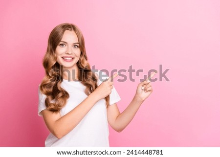 Portrait of young beaming smiling woman wearing white t shirt indicate fingers website subscribe blog isolated on pink color background