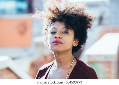 Portrait Of Young Beautiful Afro Black Woman Looking At Camera Resolute - Determination, Resolved, Woman Power Concept