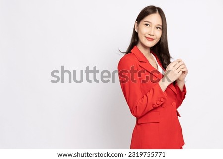 Portrait of Young beautiful Asian businesswoman in red suit smiling isolated on white background