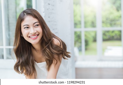 Portrait of young beautiful asian sexy woman relax at home in spring or summer. Smile happy asian girl with perfect clear glow skin face. Asia lifestyle people education beauty girl next door concept.