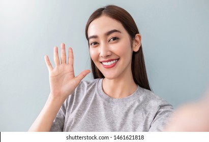 Portrait Of Young Beautiful Asian Woman  Using Smart Phone Selfie Say Hi On Live Internet. Happy Asian Girl Online Influencer Idol Blogger. Education Technology Connect People Woman Lifestyle Concept