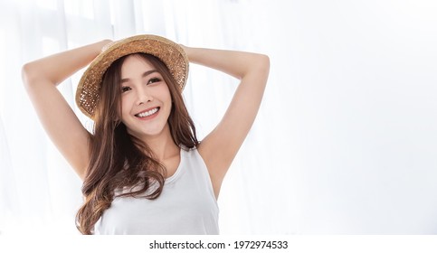 Portrait Of Young Beautiful Asian Woman On Holiday Vacation Summer Time In White Bedroom. Happy Cheerful Girl In Summer. Korean Makeup Under Arm Skincare. University Woman Fashion Lifestyle Banner